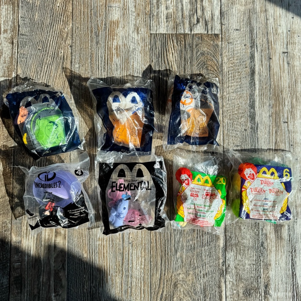 McDonald’s Happy Meal Disney Toys - SEALED - Lot Of 7 Sealed Toys 1999-2023